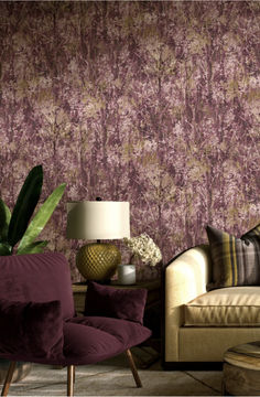 a living room filled with furniture and a large flower wallpapered wall behind it