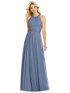 a woman wearing a long blue bridesmaid dress with halt neck and pleaed skirt