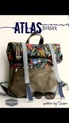 a bag with sunglasses on it and the words atlas written in blue ink above it