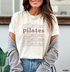 Pilates Shirt Custom gift for pilates teachers and pilates instructors. Retail fit. Size up for oversized look. Classic pilates shirt makes the perfect gift for all pilates girls!   If you have any questions or would like this design on a different shirt style or size, please message and I will be happy to do a custom order for you. *Designs are applied with a direct to garment method (DTG). Ink is applied directly to the fabric and absorbs into the garment. This method creates a longer lasting print. The colors are often fused with the color of the garment causing slight variations in the color depending on the garment color. The soft-washed, garment-dyed fabric brings extra coziness to your wardrobe while the relaxed fit makes it an excellent daily choice. The double-needle stitching thr Fitness Instructor Outfit, Pilates Branding, Classic Pilates, Pilates Ideas, Pilates Shirt, Pilates Outfit, Pilates Clothes, Pilates Teacher, Pilates Instructor