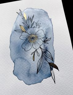 a watercolor drawing of a flower on paper