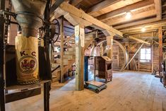 the inside of a building with wooden floors and walls