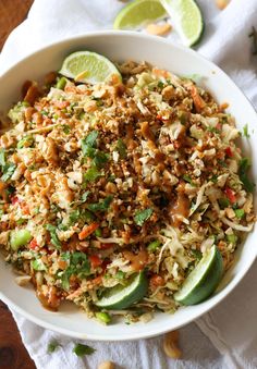 a white bowl filled with rice and vegetables