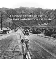 a woman is walking down the road with her arms in the air and a quote on it