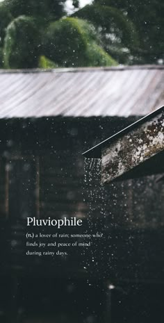 the words pluvophilie are written in front of an old wooden building