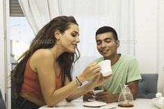 Happy Young Couple Having fun and Drinking Coffee in the Kitchen by Nick_Paschalis. Happy Young Couple Having fun and Drinking Coffee in the Kitchen. Coffee Time #Sponsored #Couple, #fun, #Happy, #Young Couple Drinking Coffee, Smart Couple, Couple Drinking, Kitchen Concept, Color Festival, Young Couple