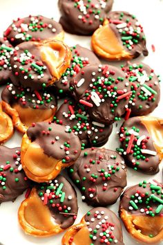 chocolate covered donuts with sprinkles and candy on them are ready to be eaten