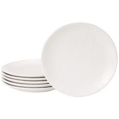 four white plates stacked on top of each other