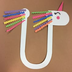 a paper cut out of the shape of a unicorn's head