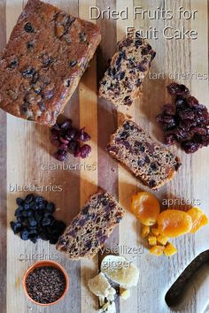 an assortment of different fruits and nuts on a cutting board with the words dried fruits for fruit cake