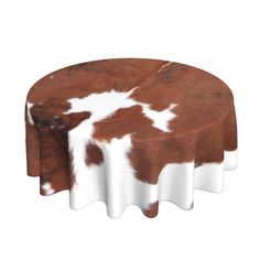 a brown and white cow print tablecloth