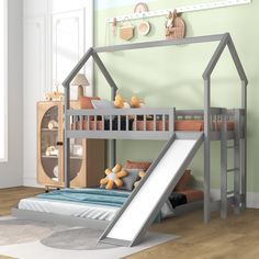 a child's bed with a slide in front of it