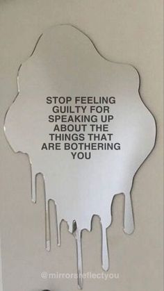 a mirror with some writing on it and a black object next to it that says, stop feeling about speaking up about the things that are boring you