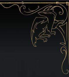 an ornate gold frame with a dragon on the front and side, against a black background