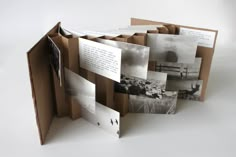 an open book with several photos on it