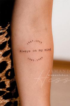 a person with a tattoo on their arm that says, you are always on my mind