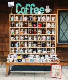 a coffee shop with many cups and mugs on display