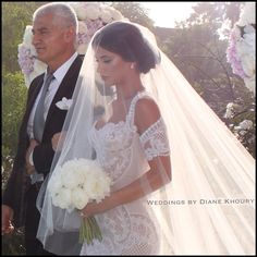 the bride is walking down the aisle with her father