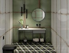 a bathroom with green walls, black and white checkered flooring and a round mirror on the wall