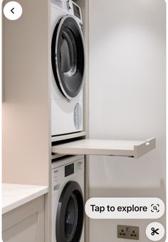 a washer and dryer sitting on top of each other in a laundry room