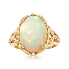 Ross-Simons - Ethiopian Opal, .28ct t. w. Diamond Ring Oval Cut in 14kt Yellow Gold. Size 6. Feast your eyes on this unique ring! A smooth 12x16mm oval cabochon of Ethiopian opal looks luminous in polished 14kt yellow gold. The fancy setting sparkles with .28 ct. t. w. round brilliant-cut diamonds, further adding to the beauty of the piece. 3/4" wide. Diamond and Ethiopian opal ring. Opal birthstones are the perfect gift for October birthdays. Diamond Ring Oval, October Birthdays, Opal Birthstone, Ethiopian Opal Ring, Types Of Opals, Ring Opal, Pink Sapphire Ring, Circle Diamond, Geometric Ring