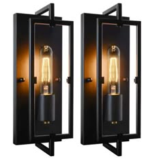 two black wall lights with one light on each side and the other on the back