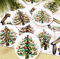 decorated christmas tree plates sitting on top of a table