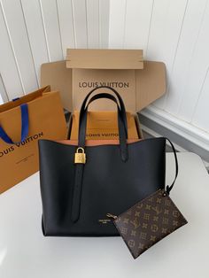 Embrace elegance with this Louis Vuitton Low Key Cabas MM-inspired tote bag in a timeless black hue. Crafted from supple grained calfskin leather, this spacious bag is perfect for everyday use. The subtle embossed logo and iconic padlock add signature Louis Vuitton touches, while the adjustable handles offer versatile carrying options. This classic and practical accessory complements any style. 30*14*47 CM Disclaimer: This product is inspired by the Louis Vuitton design and is not an official Lo Luxury Black Monogram Canvas Bags, Louis Vuitton Black Bag, Louis Vuitton Bag Black, Black Leather Louis Vuitton Bag, Fall Winter Jacket, Buy Louis Vuitton, Louis Vuitton Black Monogram Bag, Loafer Sneakers, Hanging Bag