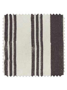 a black and white striped rug on top of a white tablecloth with two rows of stripes