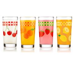 four glasses filled with different types of fruit juices and drinks on a white background