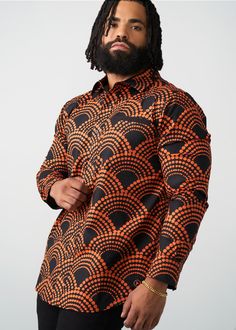 Style#: M2106 Meet the classic fall flannel's cousin, the Mazi Men's African Print Button-Up Shirt. The Black Amber Dots print gives all the fall vibes with an African twist. Features: Slightly rounded hem 97% Cotton/3% Lycra Stretch Poplin printed body, sleeves and patch pocket at chest 97% Cotton/3% Lycra Stretch Poplin Contrast Fabric at the Welt Pocket, Hidden Placket, and the Inner Sleeve Cuff Designed in the USA, imported Care Instructions: Machine wash cold on a gentle cycle with non-chlo Retro Black Shirt For Fall, Retro Black Long Sleeve Shirt, Fall Flannel, Sleeve Cuff, Mens Fall, Workout Accessories, Printed Bags, Womens Fall, Swimwear Accessories