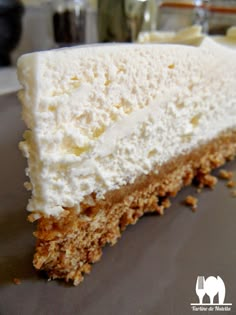 a piece of cake sitting on top of a plate with white frosting and crumbs