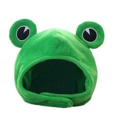 a green frog hat with eyes and ears