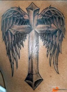 a cross with wings on the back of it