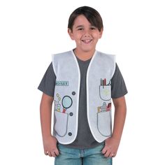 a little boy that is standing up wearing a vest