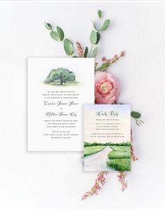 the wedding stationery is laid out on top of each other, with pink flowers and greenery