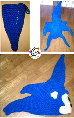 crocheted blue hat with white eyes and tail laying on the floor next to it