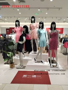 there are many mannequins in the store