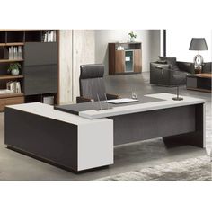 an office desk with black and white furniture