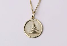 "14k Gold Sailing Yacht On Wave Necklace, Personalized Sailboat Pendant, Dainty Boat Necklace, Yacht Pendant, Ship Necklace, Ocean Lover Gift, Best Friend Gift, Gold Jewelry Gift, necklace for woman, necklace for man * Material: Pendant and chain are 14k Yellow Solid Gold or 925 Sterling Silver * Pendant thickness: 0.70 mm * Inner diameter of jump ring: 4 mm * Pendant diameter: 0.55 inch (14 mm) 0.60 inch (15.30 mm) 0.65 inch (16.50 mm) 0.70 inch (17.78 mm) 0.75 inch (19.10 mm) * Chain length: 1 Sailboat Necklace, Ship Necklace, Gold Schmuck, Gold Jewelry Gift, Wave Necklace, Ocean Lover, Sailing Yacht, Engraved Necklace, Romantic Gifts