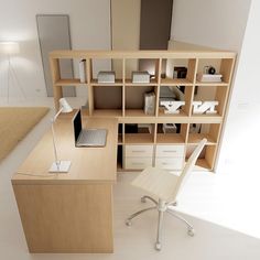 a computer desk with a laptop on top of it next to a book shelf filled with books