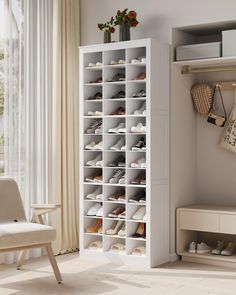 a white shoe rack sitting next to a window in a living room with a chair