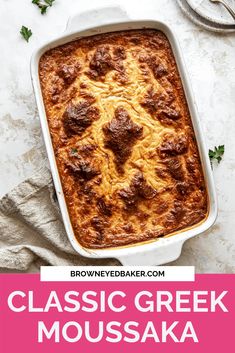 a casserole dish with meat in it and the words classic greek moussaka