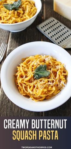 creamy butternut squash pasta in a white bowl with parmesan cheese on the side