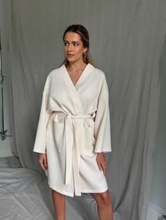 Looking for a cotton bathrobe that's as comfortable as it is stylish? Our kimono bathrobe is the perfect choice for you. This waffle bathrobe is handmade with love from the finest certified organic cotton, and it's the epitome of luxury and quality. It's incredibly durable, ensuring you'll enjoy its softness for years to come. This white waffle robe is made from cotton that meets the stringent OEKO-Tex ecological standards, assuring you that it's free from harmful substances and eco-friendly. Whether you have sensitive skin or not, this bathrobe is a dream to wear. Upgrade your relaxation with our 100% organic cotton bathrobe today! ✅ FEATURES: 👉 Handmade with love. 👉 100% organic cotton. 👉 Oversized and comfy. 👉 Robe has a pocket. 👉 Beautifully wrapped and boxed. The model height: 17 Cotton Long Sleeve Overnight Robe, Beige Cotton Robe For Daywear, Long Sleeve Cream Robe For Home, Cream Long Sleeve Home Robe, Waffle Bathrobe, Kimono Bathrobe, Cotton Bathrobe, Mode Kimono, Kimono Style