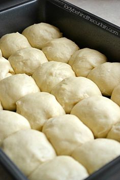 a pan filled with dough sitting on top of a counter