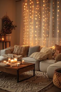 a living room filled with lots of candles and lights hanging from the wall above it