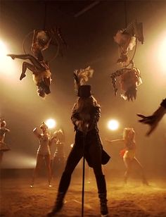 a man standing in front of a group of people on stage