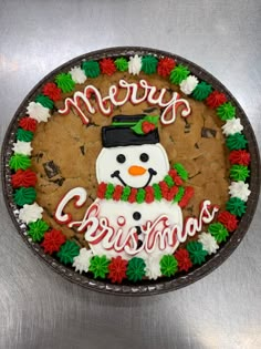 a christmas cookie decorated like a snowman