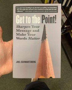 a person holding up a book with a pencil in it's hand and the title get to the point